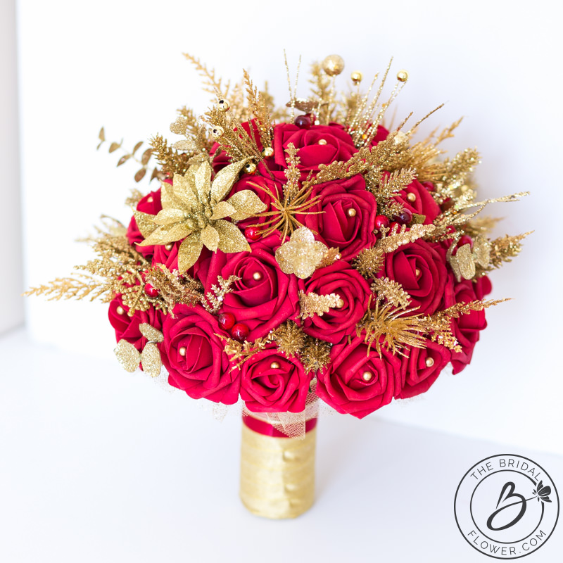 Red and gold glitter winter wedding bouquet The Bridal